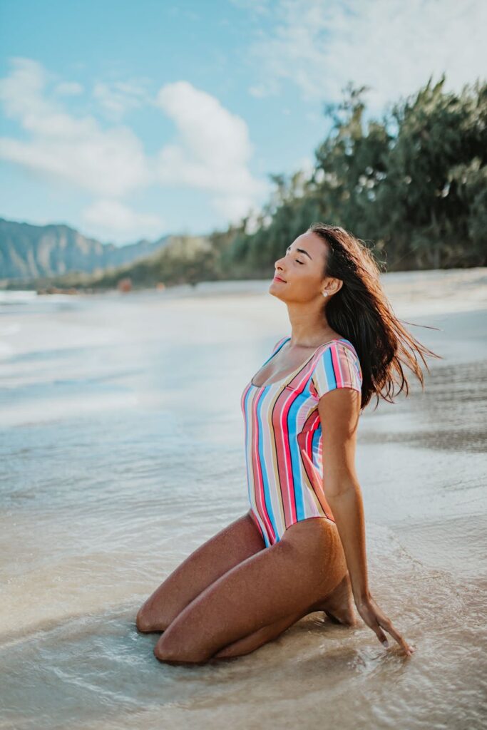 woman in the beach enjoying the sun