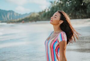 woman in the beach enjoying the sun