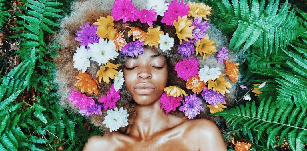 African woman with flowers