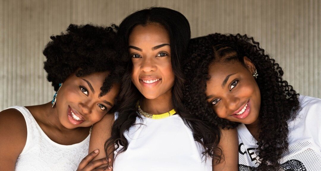 three African american woman smiling