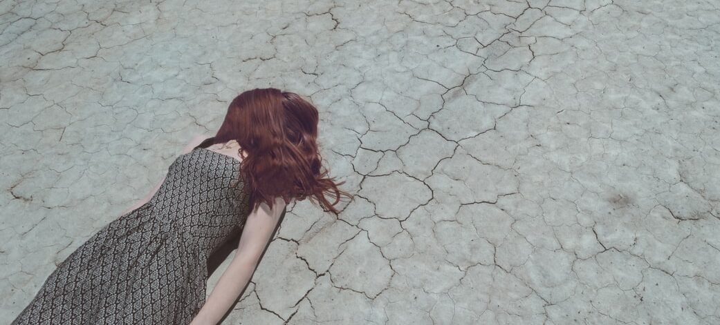 woman asleep in a dry ground